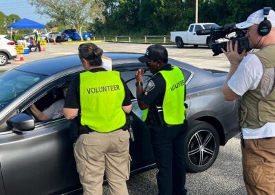 Filming the Palm Bay PD volunteers assist drivers at the CarFit Event